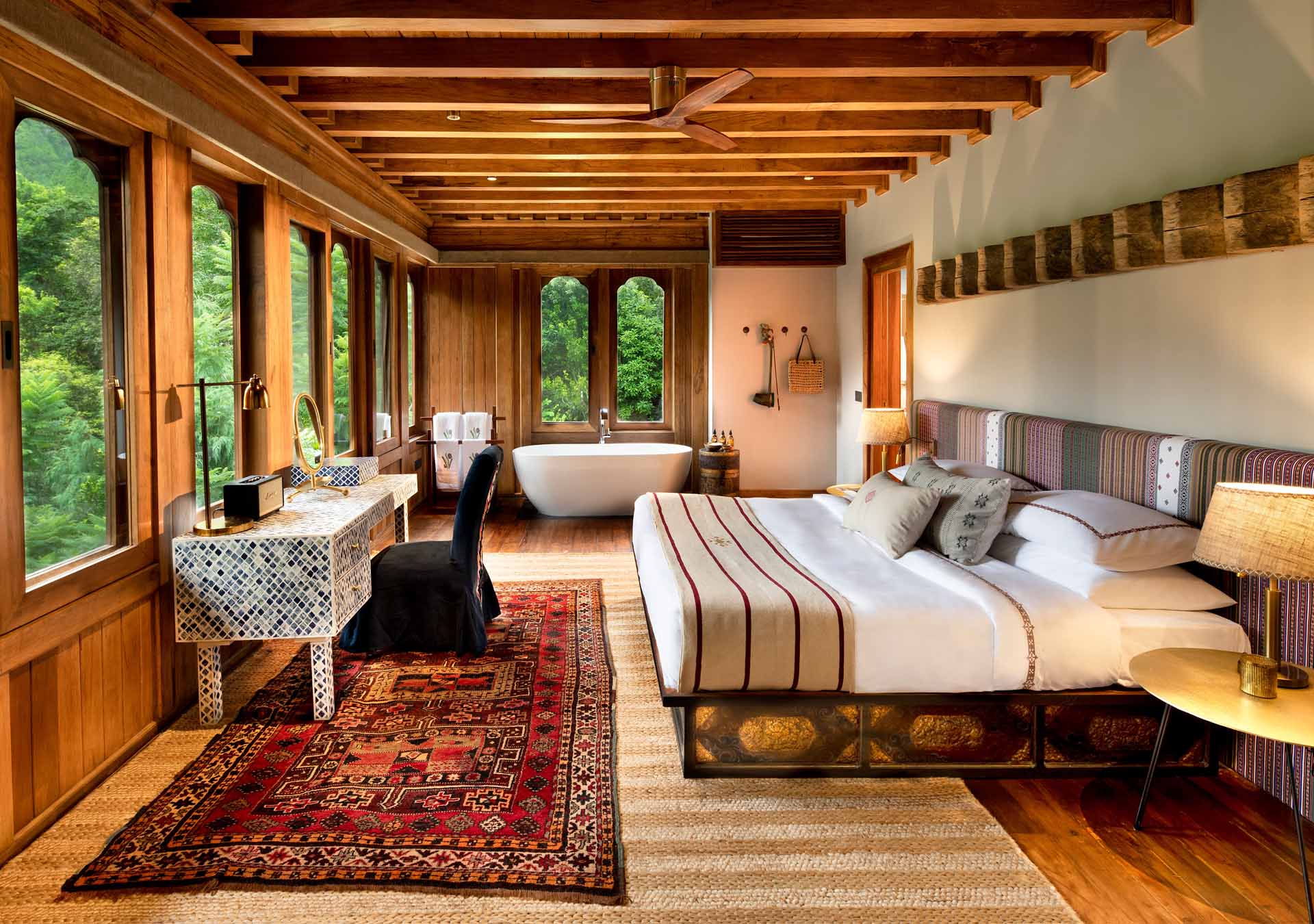 A warmly lit luxury lodge interior in Bhutan